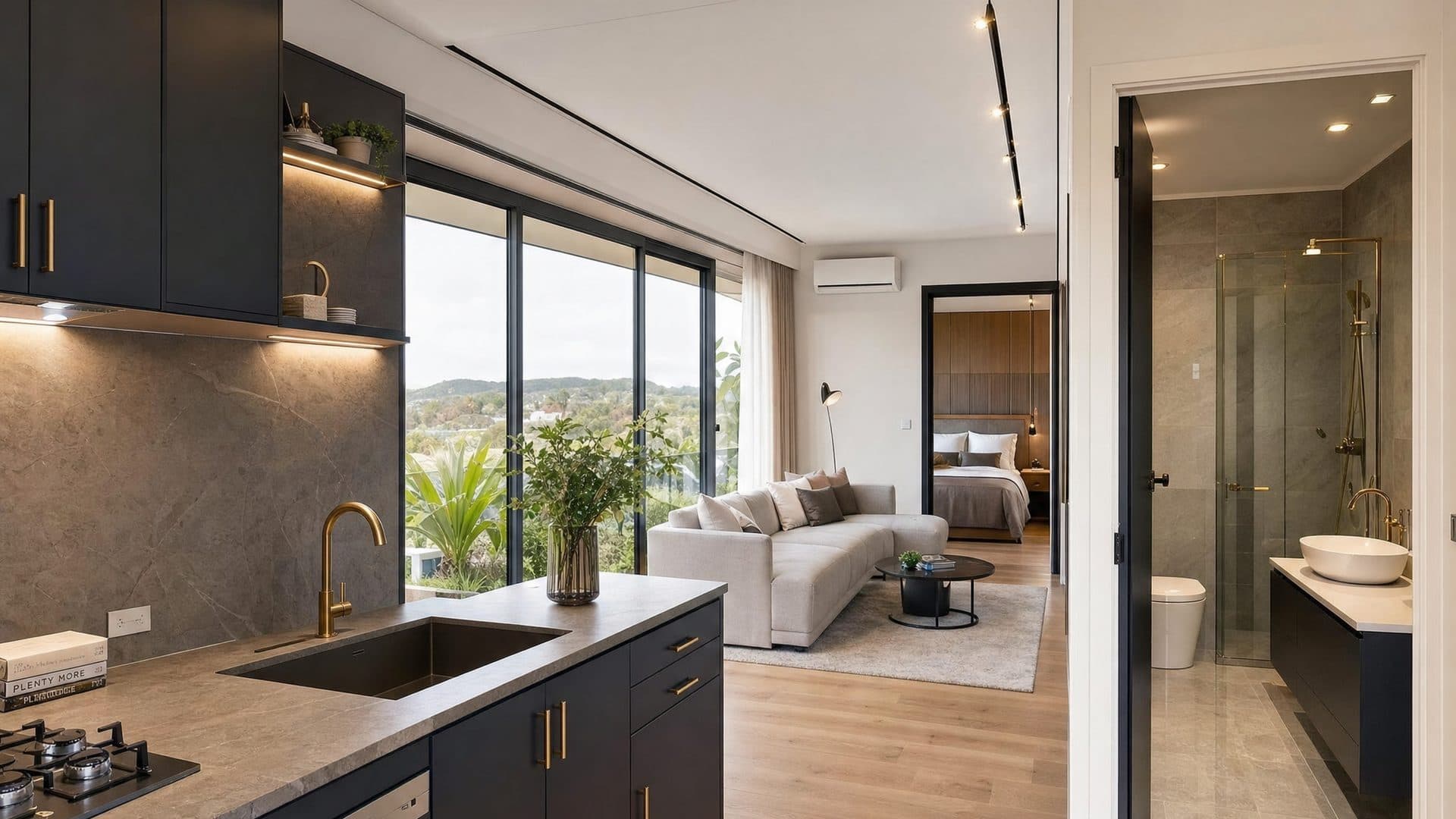 abodemore interior — open plan living with black cabinetry and gold hardware